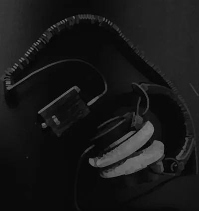 Headphones resting on a dark surface